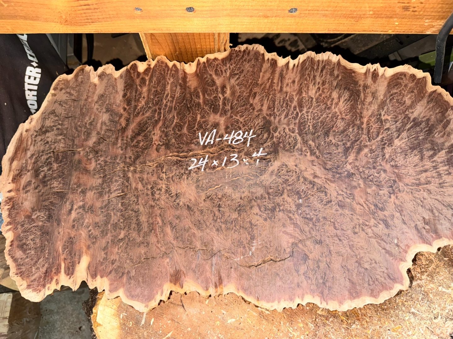 Vasticola burl chunk cut open, orange interior visible.